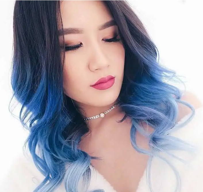 Curly wavy hairstyle with navy blue dye