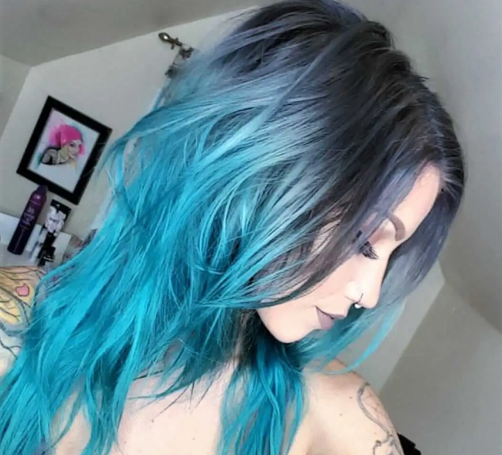 Long curly style with blue hair tips